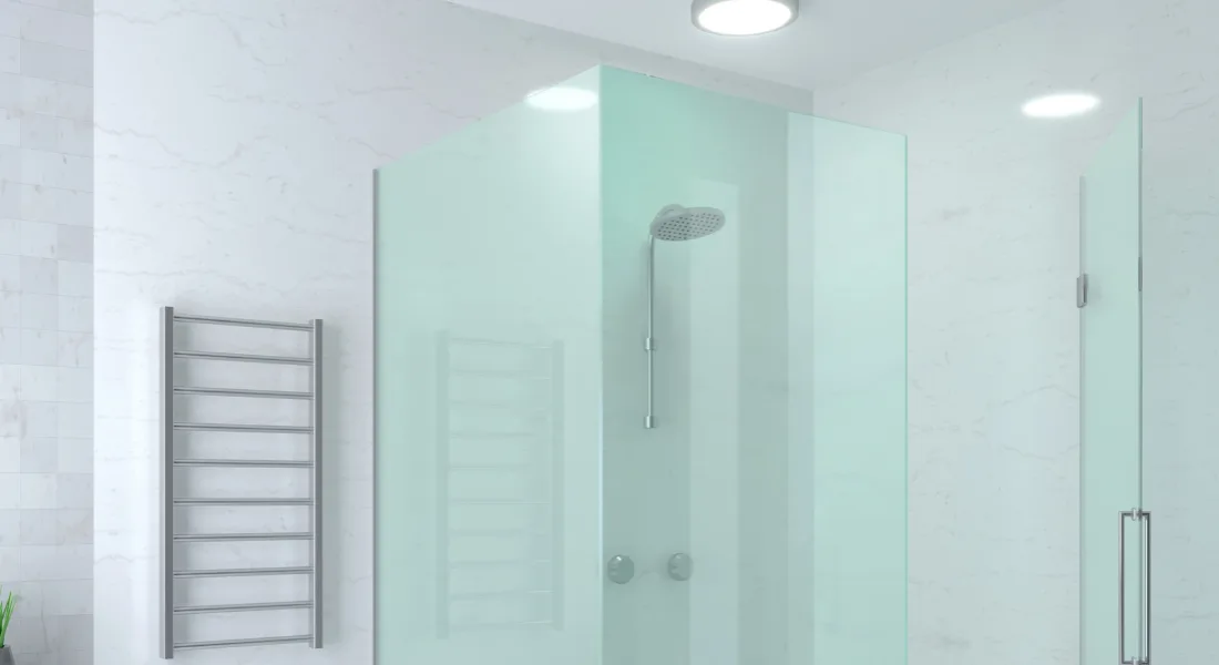 Frameless glass shower door in a modern bathroom