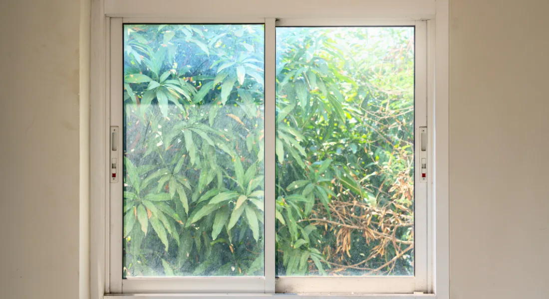 Window showing signs of seal failure with foggy appearance