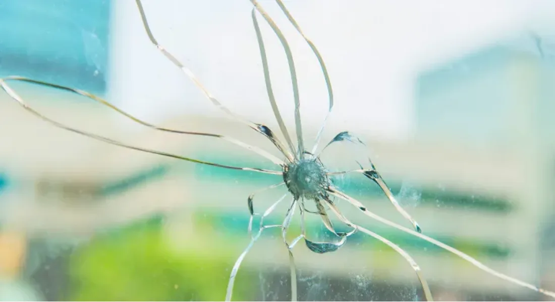 Hand applying repair resin to a cracked window
