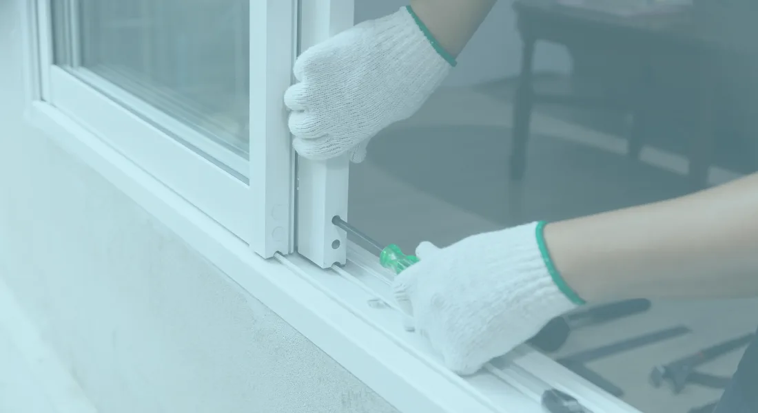 Professional installing replacement window glass