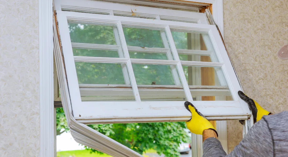 Window pane being measured for replacement